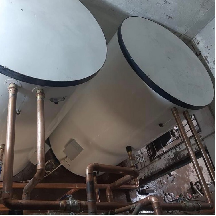 Custom-fit hot water storage cylinders and copper manifold installation designed and commissioned by DBCon Global
